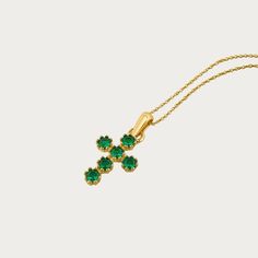 This 14k Yellow Gold Emerald Cross Necklace Is A Modern Take On The Classic Cross Symbol. A Series Of Round Emeralds Are Set To Give This Pendant Its Elegant Appeal. Adjustable Box Chain Included. Material: 14k Solid Gold Stone: Emerald Cz Weight: 2.7 Grams Cross Green Necklace, Emerald Cross Necklace, Elegant May Birthstone Cross Pendant Jewelry, Elegant Green Cross Pendant Necklace, Emerald Cross, Cross Symbol, Box Chain, Womens Jewelry Necklace, Cross Necklace