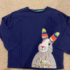 This Shirt Was Never Worn So It’s In Like New Condition. It Has A Beautiful Bunny Mixed Fabric Detail That Means You Can Wear It With Anything! The Shirt Is So Soft And Is Ready For It’s Next Owner. Fun Blue Tops For Playtime, Cute Long Sleeve Blue Tops, Cute Blue Tops For Playwear, Playful Blue Cotton Top, Multicolor Long Sleeve Tops For Playwear, Fun Blue Long Sleeve T-shirt, Fun Long Sleeve T-shirt For Spring, Cute Multicolor Long Sleeve T-shirt, Playful Blue Long Sleeve Top