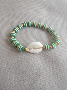 This green seashell bracelet if perfect for any occasion and any day. Enjoy! We specialize in bracelets for toddlers as well, just make sure to accurately measure their wrist size in inches. NOTE: We recommend keeping away from any liquids or lotions, and chemicals to help them always look new. :) Seashell Bracelet, Clay Beads, Favorite Things Gift, Wedding Shop, Sea Shells, Lotion, Jewelry Bracelets, Bracelet, Birthday Gifts