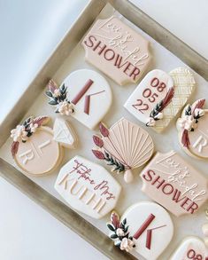 decorated cookies in a box with names and date on them for someone's special occasion