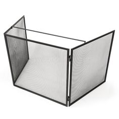 a black metal fire screen with mesh panels on the front and back sides, open to reveal