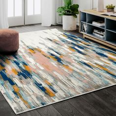 an area rug with various colors and shapes