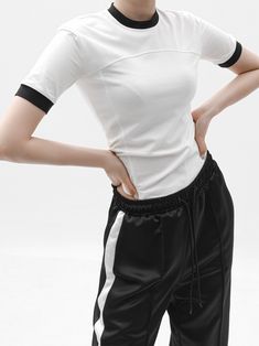 A half sleeve cotton top with rounded neckline. Contrast color detail at neckline and cuffs. Slight stretch with spandex. Model is wearing MINUSEY ONE SIZE. * MINUSEY ONE SIZE = EU 34-38, US 2-6* 95% Cotton / 5% Spandex* Dry clean* Made in Korea - Model Height: 173cm/5'8" (US 2, EU 34) Spring White T-shirt With Contrast Color, Sporty White T-shirt With Contrast Sleeves, White Sporty T-shirt With Contrast Sleeves, White T-shirt With Contrast Color For Spring, White Short Sleeve Tops With Contrast Sleeves, Short Sleeve T-shirt With Contrast Trim For Spring, White T-shirt With Contrast Stripes, Sporty Short Sleeve Tops With Contrast Panels, Short Sleeve Stretch T-shirt With Contrast Color