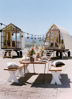 two tiny houses are set up in the desert