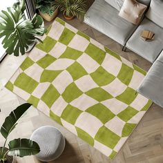 a green and white area rug in the middle of a living room