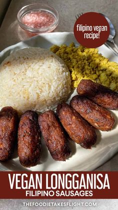 a white plate topped with meat and rice