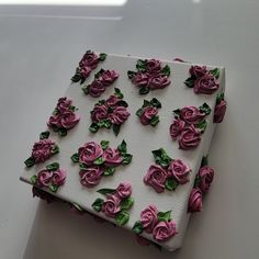 a white box with pink roses on it