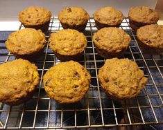 twelve muffins cooling on a wire rack in the oven, ready to be eaten