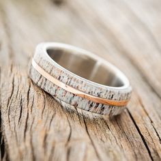 a wedding band made out of wood and silver