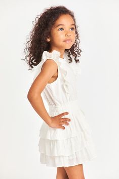 Meet our Decker Dress for girls in 100% cotton with custom lace. This easy frock has a ruffle-trimmed collar, buttons down center front, flutter sleeves, an elastic waist and overlapping asymmetrical ruffles at the skirt. Girls Designer Dresses, Dress For Girls, Dreamy Dress, Flutter Sleeves, Flutter Sleeve, Kids Dress, Women Girl, Dresses For Sale