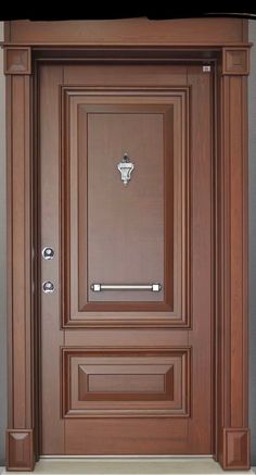 the front door is made of wood and has a metal handle on it's side