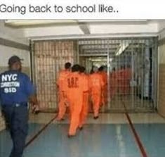 two men in orange prison uniforms are walking through the jail cell area with their backs turned towards each other