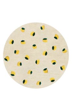 a round rug with lemons on it