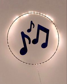 there is a sign with musical notes in the center and lights around it that are lit up