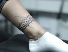 a woman's foot with a tattoo on her left ankle and the word, elbernds