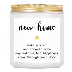 a white jar with a gold lid that says, new home make a wish and forever more may nothing but happiness come through your door