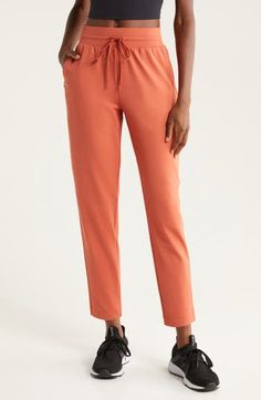 The technical fabric of these surprisingly polished sweatpants is wonderfully smooth and soft to the touch, while the pocket detailing and ankle-length cuffs make them easy to dress up or down. 26" inseam; 12" leg opening; 12" front rise; 16" back rise (size Medium) Elastic/drawstring waist Side hidden-zip pockets 93% polyester, 7% spandex Machine wash, tumble dry Imported Lift Off, Active Wear Pants, Ankle Pants, Pocket Detail, Active Wear For Women, Ankle Length, Drawstring Waist, Zip Pockets, Rust