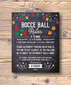 a chalkboard sign on a wooden wall that says bocce ball rules 2 teams