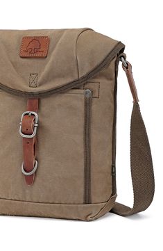 Featuring our military-Inspired Forest Crossbody Bag, designed and handcrafted from high-quality canvas, which allows you to securely carry all of your essentials at ease. 8"W x 10"H x 3"D; 25" strap drop Textile/leather/metal Imported Durable Khaki Shoulder Bag For Everyday Use, Durable Canvas Standard Backpack, Khaki Utility Canvas Bags, Canvas Crossbody Backpack With Pockets, Durable Everyday Waxed Canvas Bag, Everyday Durable Waxed Canvas Bag, Durable Crossbody Shoulder Bag For Everyday Use, Durable Canvas Shoulder Bag For Travel, Durable Canvas Shoulder Bag For Daily Use