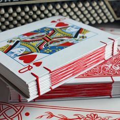 several playing cards stacked on top of each other