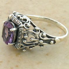 Sterling Silver Amethyst Promise Ring With Intricate Design, Classic Purple Sterling Silver Ring, Ornate Sterling Silver Amethyst Ring, Sterling Silver Amethyst Ring With Intricate Design, Ornate Sterling Silver Amethyst Gemstone Ring, Vintage Adjustable Amethyst Ring In Sterling Silver, Adjustable Vintage Sterling Silver Amethyst Ring, Intricate Amethyst Ring In Sterling Silver, Intricate Design Amethyst Ring In Sterling Silver