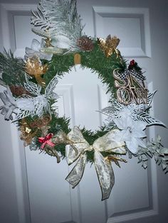 a christmas wreath hanging on the front door