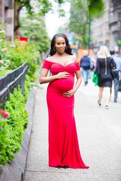 This bright red sweetheart neckline maternity gown will make everyones jaw drop!  Maternity gown. Custom maternity gown. Fall maternity gown. Winter maternity gown. Short sleeve maternity gown. Off the shoulder maternity gown. Sweetheart maternity gown. Pregnancy gown. Pregnant gown. Maternity photo shoot. Couple maternity shoot. Pregnancy photo shoot. Couple photo shoot. Maternity brands. Maternity shoot. Maternity session. Maternity photography. Maternity photoshoot. Maternity style.  #33weeks Fitted Off-shoulder Maternity Dress For Wedding, Elegant Maternity Dress With Sweetheart Neckline, Maternity Fitted Gown With Sweetheart Neckline, Maternity Gown With Sweetheart Neckline, Fitted Maternity Gown With Sweetheart Neckline, Maternity Wedding Dress With Sweetheart Neckline, Maternity Fitted Dress With Sweetheart Neckline, Fitted Empire Waist Maternity Dress For Wedding, Fitted Empire Waist Maternity Maxi Dress