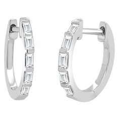 This pair of Diamond Baguette Huggie Hoop Earrings are sure to be your new favorite. With shimmering 0.25 ct. of baguette-cut diamonds adorning the Huggie, they create the perfect amount of sparkle for any look. Crafted in 14k Rose Gold with easy to use latch back posts these diamond earrings are the perfect everyday accessory and an ideal gift for any occasion. 14K Gold 0.25 carats Natural White Diamonds Baguette Cut Diamonds Latch Back Posts Gift Box Included! Ships in 1-2 Business Days! Elle Jewelry, Diamond Baguette, Huggie Earring, Colored Stone Rings, Diamond Gift, Large Hoop Earrings, Jewelry Repair, Custom Jewelry Design, Huggie Hoop Earrings