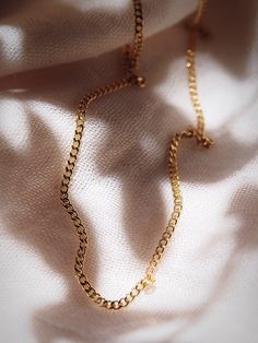 Staple basic piece for your gold necklace collection, our dainty gold curb chain is the perfect gold chain. Made from 18kt Gold Filled, this versatile, delicate, chain is the perfect layering essential ✦ DETAILS ✦✧ Name: Keanu - (keh-A-noo) - the breeze.✧ Thickness: 2mm.✧ 18kt Gold Filled.✧ All Ke Aloha Jewelry pieces come packaged thoughtfully, beautifully, and ready for gift giving. Delicate Gold Jewelry With Curb Chain, Gold Figaro Chain Necklace For Everyday, Everyday Gold Figaro Chain Necklace, Dainty Yellow Gold Chain Link Charm Necklace, Cuban Link Necklace With Adjustable Chain For Gift, Delicate Gold Necklace With Cable Chain, Dainty 14k Gold Charm Necklaces With Gold Chain, Dainty 14k Gold Chain Charm Necklace, Gold-plated Charm Necklace With Cable Chain