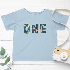 ☺ Dinosaur 1st Birthday Shirt, Dino Birthday, First Birthday Shirt, Dinosaur First Birthday Shirt, Dinosaur Theme Birthday Party, ONE Shirt ☺ Perfect shirt for your little one's first birthday! A great gift for your kids, grandkids, nieces, nephews on their special day. An easy way to make them feel glad. ☺ This classic unisex jersey short sleeve tee fits like a well-loved favorite. Solid colors are 100% cotton. These t-shirts have-ribbed knit collars to bolster shaping. The shoulders have tapin Dinosaur 1st Birthday, Dinosaur Theme Birthday, 1st Birthday Shirt, First Birthday Shirt, Dinosaur First Birthday, 1st Birthday Shirts, First Birthday Shirts, Dino Birthday, Theme Birthday Party