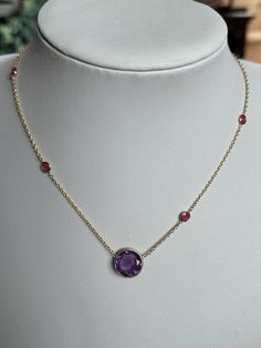 A brand new 18k Gold Vermeil (plated)  necklace. Natural amethyst  stone and smaller ruby stones.  What is Vermeil? Whilst similar to gold plating gold vermeil is distinctly different to it. Gold vermeil originated in the 19th century where gold was applied to sterling silver. Although still using the plating technique gold vermeil requires a thicker layer. At least 2.5 microns of gold.  Stamped 925 silver as this is the base metal with gold vermeil, this was bought as a collection of jewellery with some pieces signed and others not. See my other listings.  Adjustable length (approx) : 40cm/45cm/48cm 3 available Box not included  WELCOME to antiquesandchic, we are a family run business offering good antiques, jewellery and collectables.  We never know what treasures we are going to list ne Yellow Gold Necklace With Gemstone Accents, Purple Necklace For Anniversary With Hallmark, Purple Hallmarked Necklaces For Anniversary, Elegant Ruby Round Necklace, Elegant Ruby Necklace With Round Stone, Classic Amethyst Purple Necklace, Luxury Yellow Gold Amethyst Necklace, Classic Purple Amethyst Necklace, Luxury Purple Necklaces For Anniversary