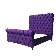 a purple couch sitting on top of a white floor