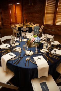 the table is set with place settings for dinner