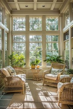 a sun room with wicker furniture and large windows