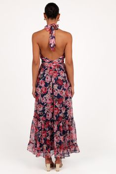 DETAILS   Its halter neck, complete with a stylish tie close, gives a flirty nod to the latest trends. The detachable center flower adds an unexpected whimsical twist it's a conversation starter! But wait, there's more. Turn around to reveal a daring open back, adding that extra dose of sass to your style.   maxi length dress  halter neck with tie close  detachable center flower  open back  invisible back zip with hook and clasp  a-line skirt panels   floral print  lined   material - 100% polyes Summer Floral Print Halter Top For Party, Summer Party Halter Top With Floral Print, Floral Print Halter Neck Top For Party, Flowy Halter Dress With Tie Back For Party, Summer Floral Print Halter Party Dress, Summer Floral Print Halter Dress For Parties, Floral Print Halter Dress For Summer Parties, Summer Party Halter Dress With Floral Print, Halter Neck Dress With Floral Print For Summer Parties