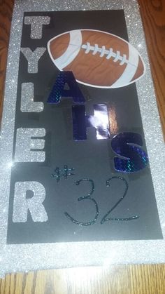 this is an image of a glittered football sign