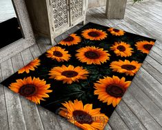 an area rug with sunflowers on it