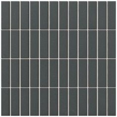 a gray tile wall with squares in it