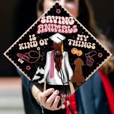 a woman wearing a graduation cap that says saving animals is kind of my thing