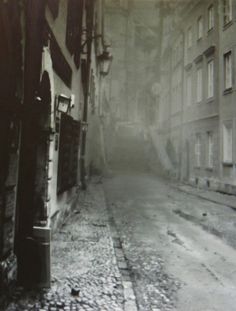 an old photo of a city street in the early 1900's