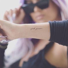 a woman with a small tattoo on her arm