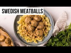 swedish meatballs and pasta on a plate with parsley next to the skillet