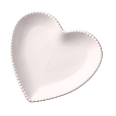 a white heart shaped plate on a white background with the shape of a heart in the center