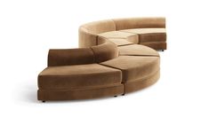 the curved couch and ottoman are made from suede