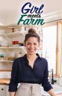 a woman standing in front of a kitchen counter with the words girl meets farm on it