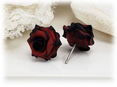 This listing is for one pair of hand sculpted black tipped red rose stud earrings. Petals are hand blended with mixed clay colors for a unique appeal. Available for pierced and non-pierced ears. Choose titanium (hypoallergenic), 925 sterling silver or 14k gold filled posts or choose metal clip ons. -Original hand sculpted polymer clay flowers -Durable, water-resistant -No molds, no paint -No glue, studs embedded within flower -Studs/Earnuts in titanium (hypoallergenic), 925 sterling silver and 1 Red Rose Earrings, Upper Lobe, Beautiful Beaded Jewelry, Gothic Rose, Rose Stud Earrings, Gothic Earrings, Rose Jewelry, Polymer Clay Flowers, Clay Flowers