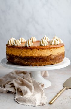 a cake sitting on top of a white cake plate