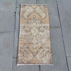 an old rug is laying on the ground