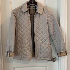 Burberry Quilted Jacket Wear Pictured Around The Right Sleeve. Price Reflects Wear Designer Quilted Outerwear For Spring, Designer Quilted Spring Outerwear, Burberry Quilted Jacket, Burberry Jacket, Quilted Jacket, Burberry, Jackets & Coats, Jackets For Women, Cream