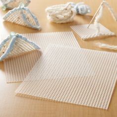 several pieces of crochet are laying on the table